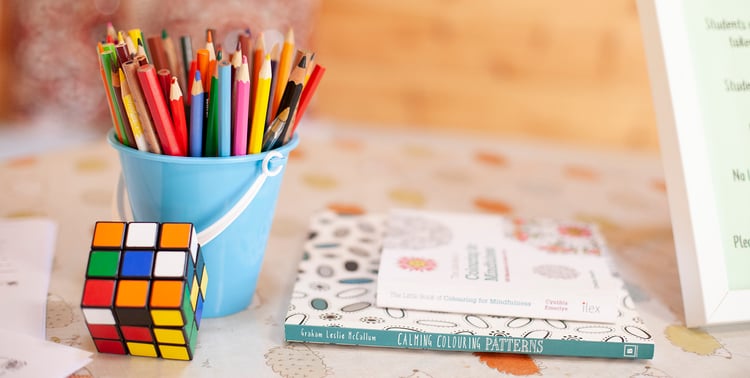 Interior close up of a table with bright colouring pencils