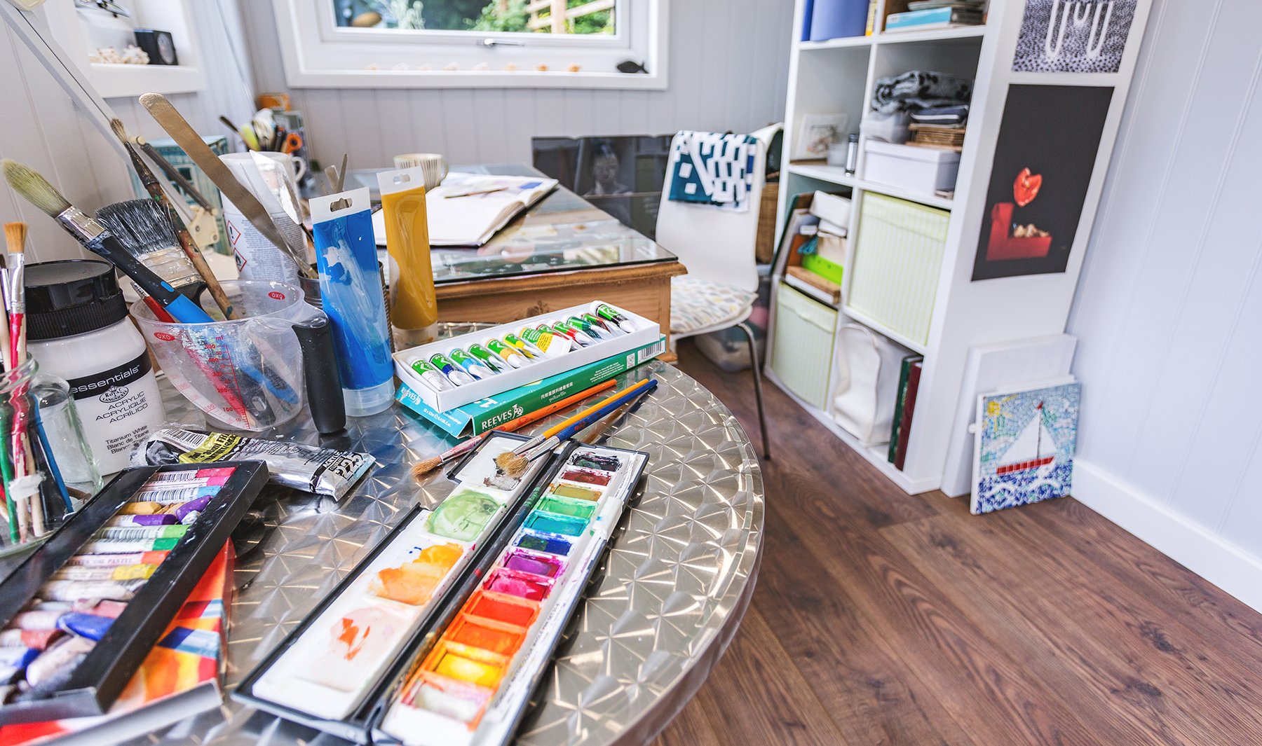 Interior of an art classroom cabin with paints and brushes