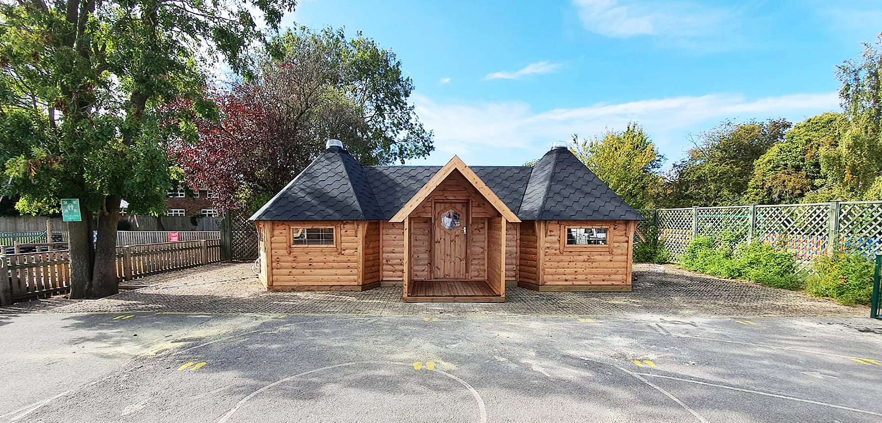 Connected school lodge cabins on playground at school