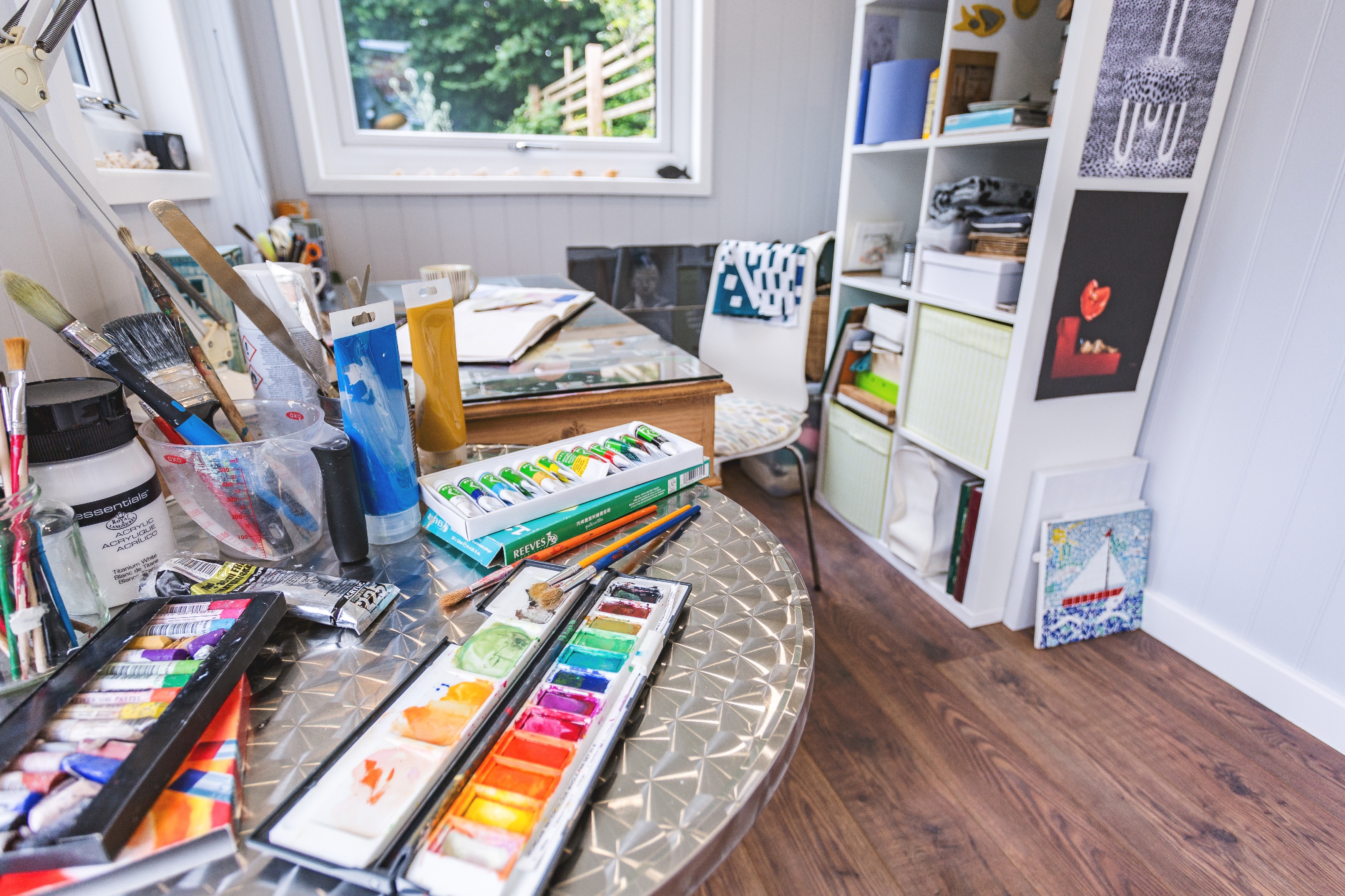 Interior of a school Art room cabin with paints and art equipment open on table