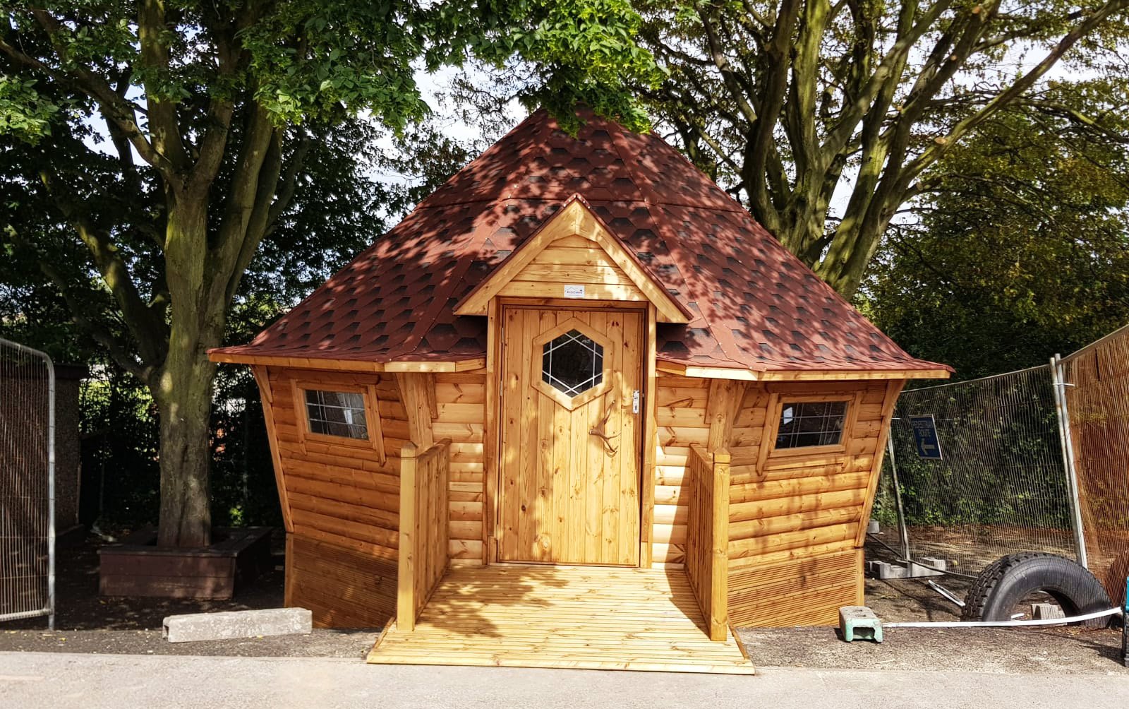 Large timber School Cabin with red roof