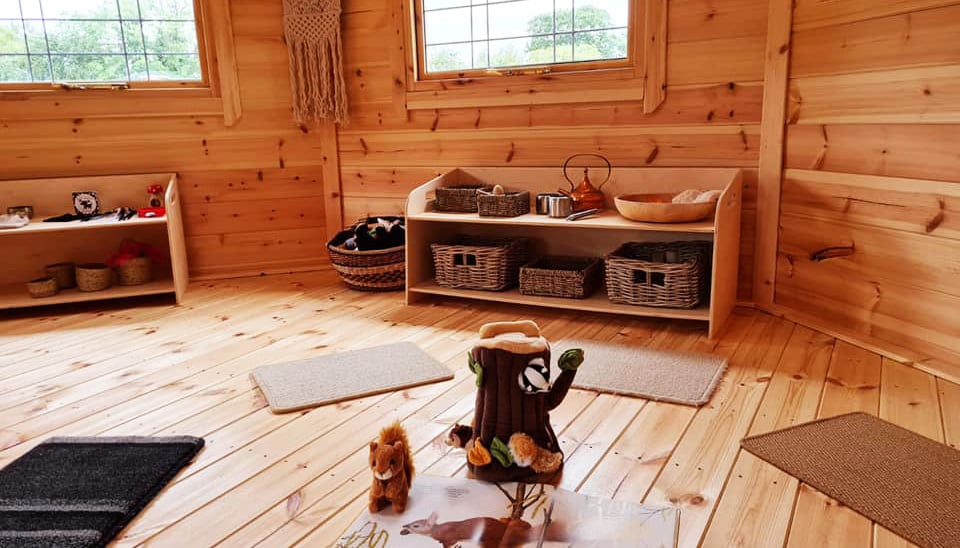 Interior of a timber forest school hut setup for nursery school children