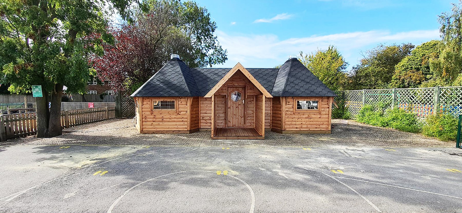 Shot of two joined Forest School Cabins on school playgrounds