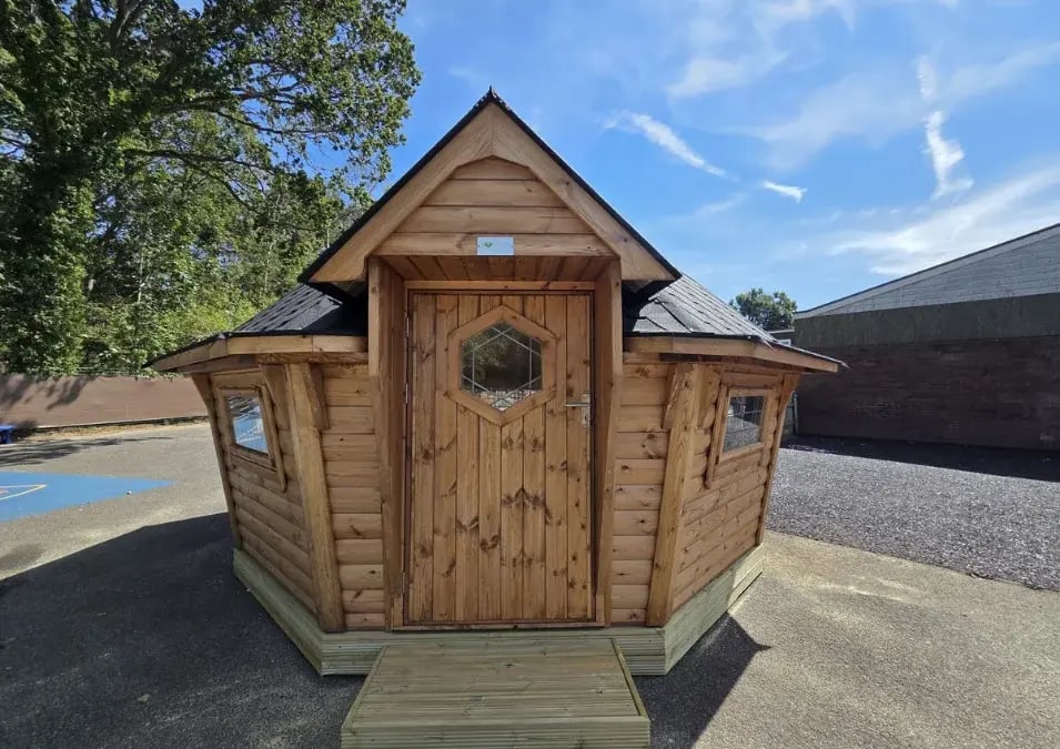 log cabin on the school playground