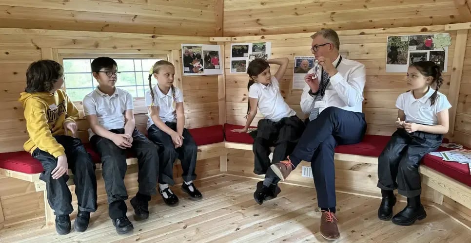 pupils-learning-in-log-cabin