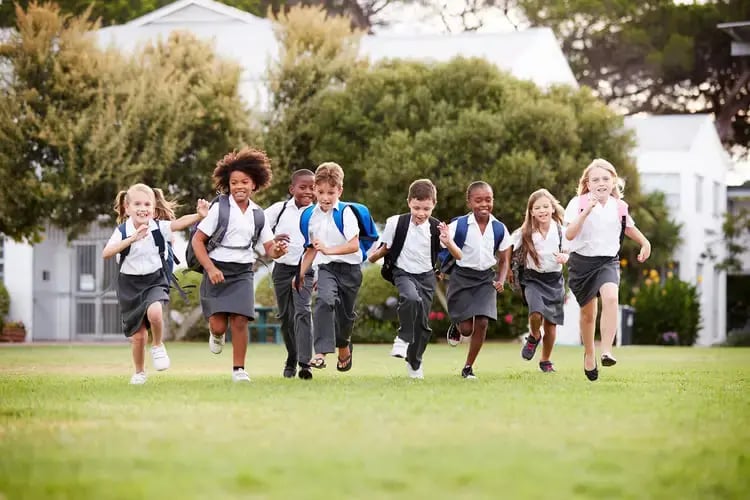 students-running-outside-together
